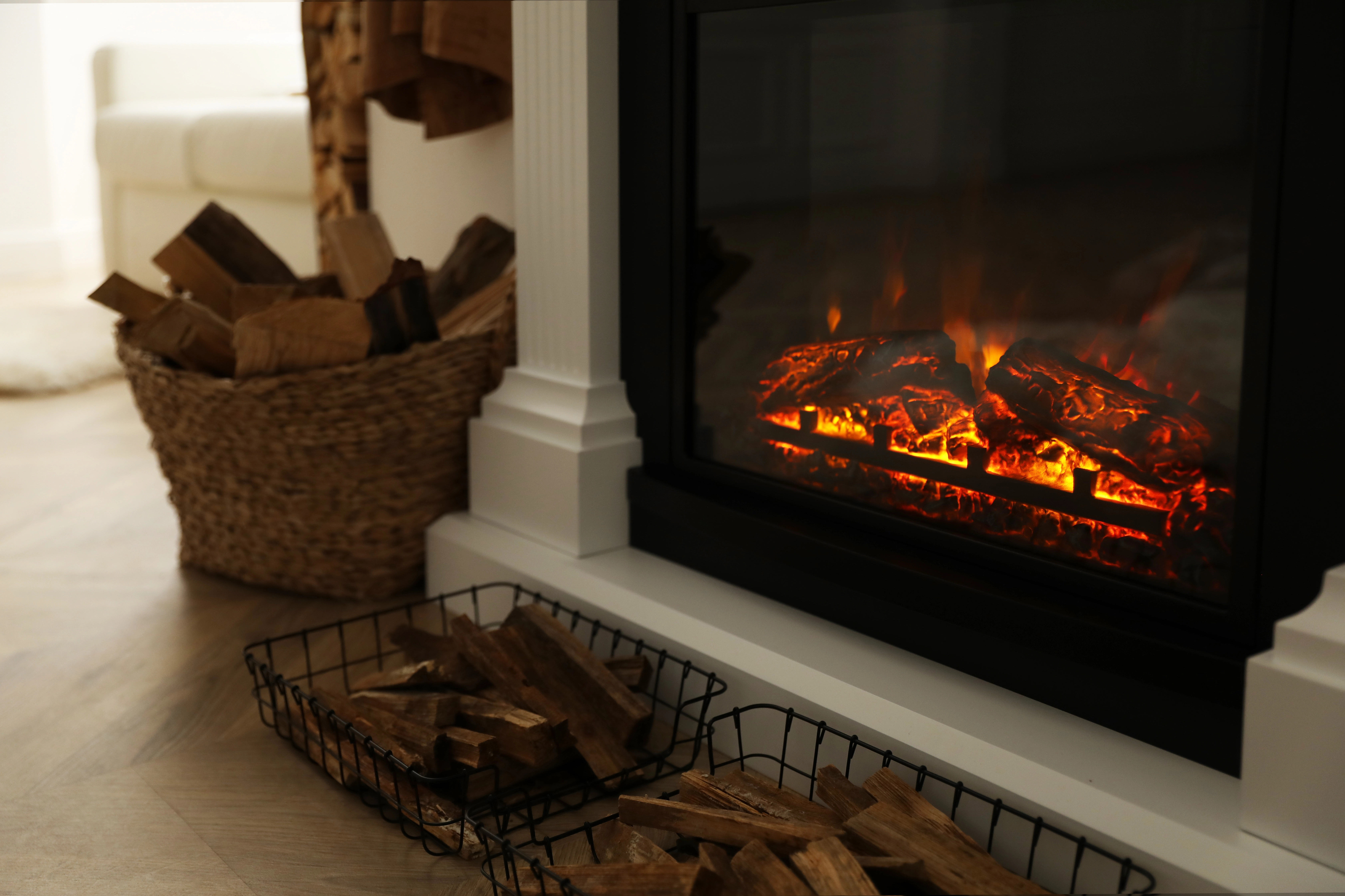 A multi-fuel stove surrounded by neatly stacked firewood