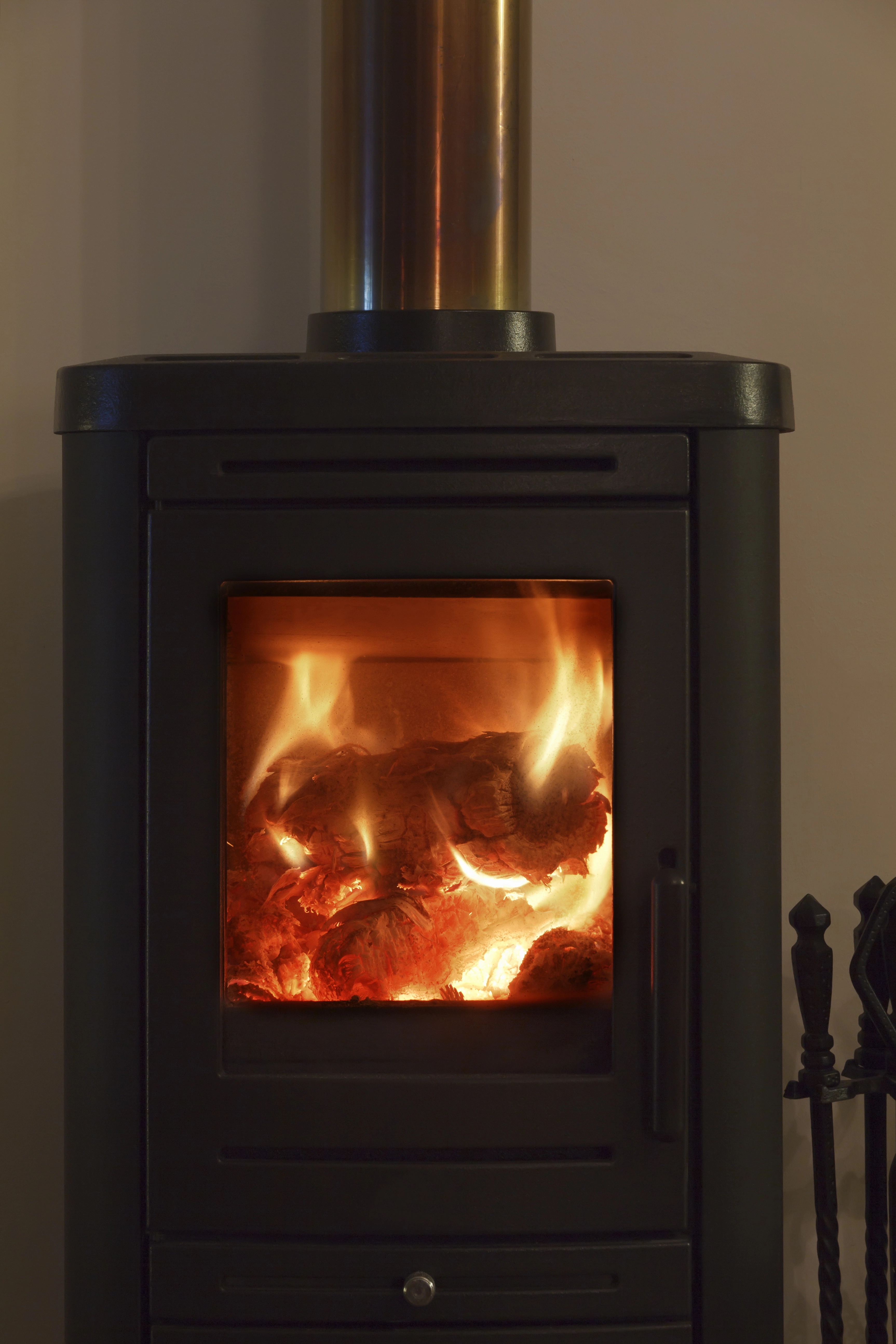 Contemporary wood burning stove — warm living room glow